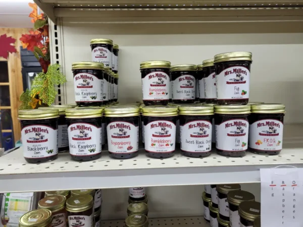 Jars of Jam Placed on a Rack